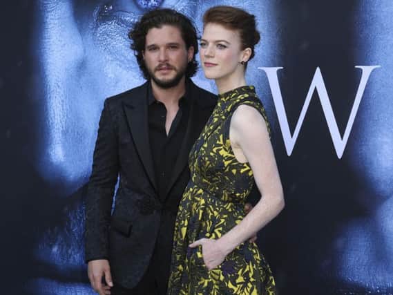 Kit Harington, left, and Rose Leslie arrive at the LA Premiere of "Game of Thrones" at The Walt Disney Concert Hall. (Photo by Willy Sanjuan/Invision/AP)