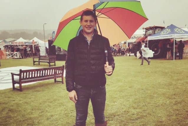 This young farmer shows off his style despite the rain