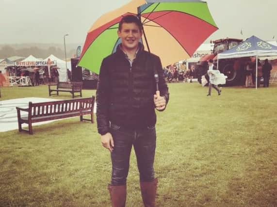 This young farmer shows off his style despite the rain