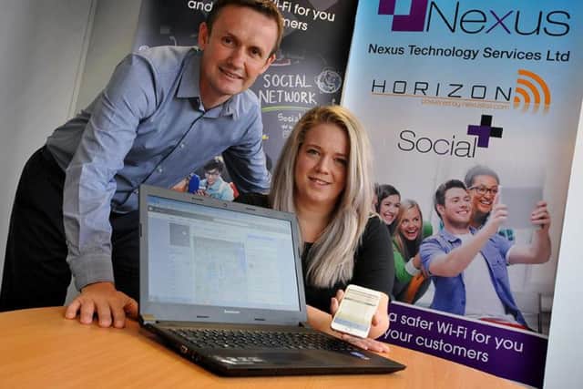 SocialPlus media manager Emma Crowe with Nexus Horizon MD Paul Sykes and their Facebook post