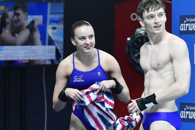 Second placed Lois Toulson and Matthew Lee of Great Britain watch the scoreboard at the Swimming World Championships 2017 in Duna Arena in Budapest, Hungary. (Tibor Illyes/MTI via AP)