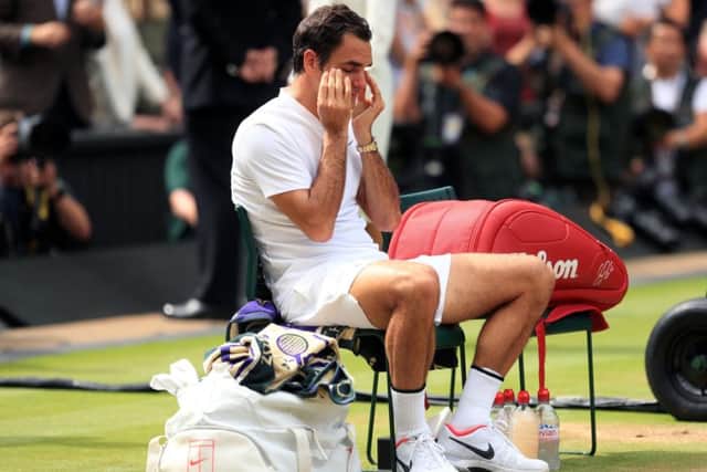 Roger Federer looks emotional following victory over Marin Cilic in the men's final at Wimbledon. Picture: Adam Davy/PA