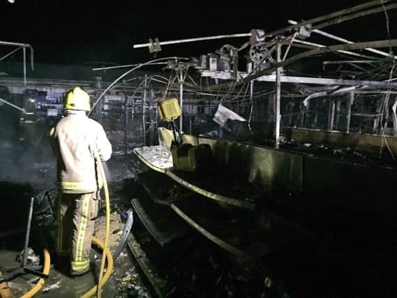 A firefighter at the garden centre this morning. Photo: West Yorkshire Fire and Rescue Service