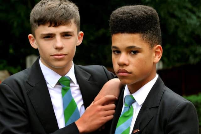 Callum and Joshua, both 14, have been threatened with isolation at the school due to their 'extreme youth culture' hairstyles