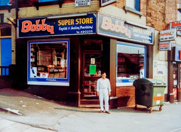 Closing down of Bobby's takeaway, on Roundhay Road, Leeds, after 43 years of business in Leeds. The shop in 1984, with NarinderThukral standing outside.