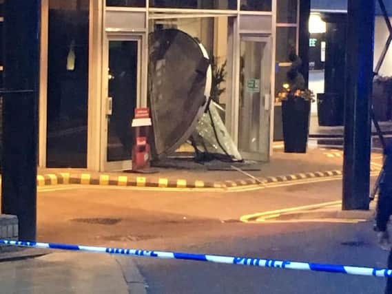 Picture of the damage to the front doors of the Hilton Hotel in Granary Wharf, Leeds. Credit: David Brook.