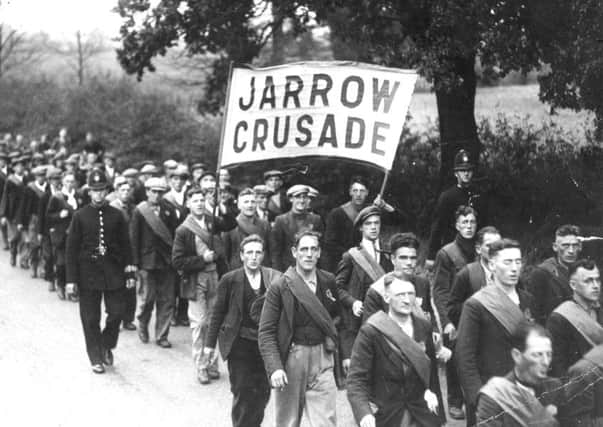 On the move: Men taking part in the original Jarrow March in 1936. (JPress).