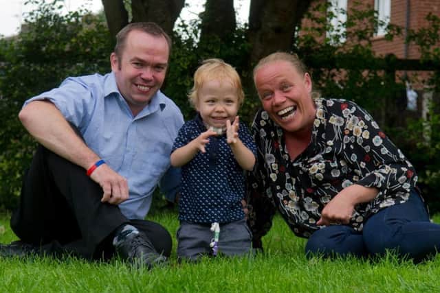 Date: 25th July 2017.
Picture James Hardisty.
Matthew and Lyndsay Smith, of Rufforth Drive, Leconfield, East Yorkshire, with thier son George, aged three who is about to have his trachiostomy removed at Leeds General Infirmary later this week (Thursday). It was first fitted at the age of three months when his family were told he would probably not survive his condition. George, spent the first eight months of his life in hospital, and now he's having it removed and is well on the road to recovery.