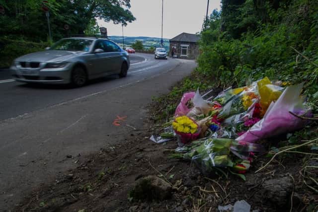 Floral tributes at at the side of A660 Leeds Road in Poo-lin-Wharfedale where Kate Whalley was struck by a car.