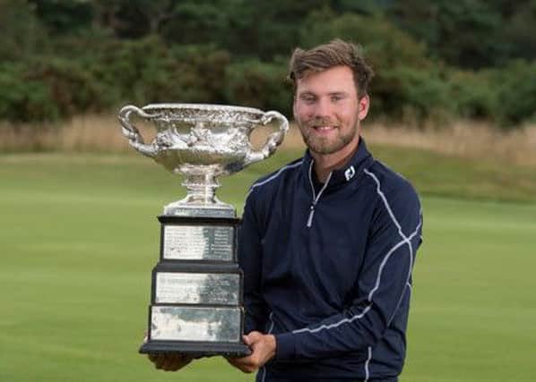Masham's Dan brown with the English men's amateur trophy after last year's win at Ganton (Picture: Leaderboard Photography).