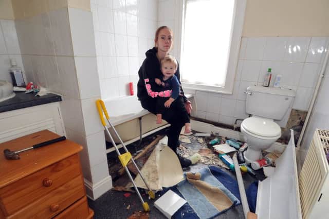 3 August 2017...... Rebecca West with son Oscar, 17 months, whose rented property on Stanley Road in Harehills is infested by snakes. The home is being ripped apart to find the reptiles but the council, landlords and the RSPCA are unable to offer assistance. Picture Tony Johnson.