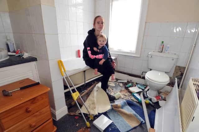 3 August 2017......   Rebecca West with son Oscar, 17 months, whose rented property on Stanley Road in Harehills is infested by snakes. The home is being ripped apart to find the reptiles but the council, landlords and the RSPCA are unable to offer assistance. Picture Tony Johnson.