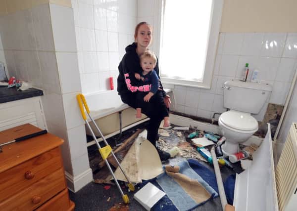 3 August 2017......   Rebecca West with son Oscar, 17 months, whose rented property on Stanley Road in Harehills is infested by snakes. The home is being ripped apart to find the reptiles but the council, housing association and the RSPCA are unable to offer assistance. Picture Tony Johnson.