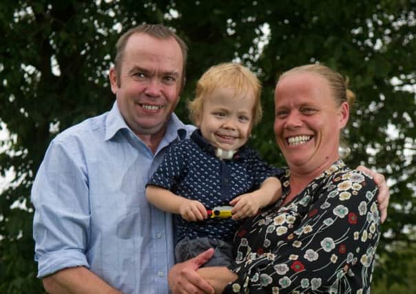 Date: 25th July 2017.
Picture James Hardisty.
Matthew and Lyndsay Smith, of Rufforth Drive, Leconfield, East Yorkshire, with thier son George, aged three who is about to have his trachiostomy removed at Leeds General Infirmary later this week (Thursday). It was first fitted at the age of three months when his family were told he would probably not survive his condition. George, spent the first eight months of his life in hospital, and now he's having it removed and is well on the road to recovery.