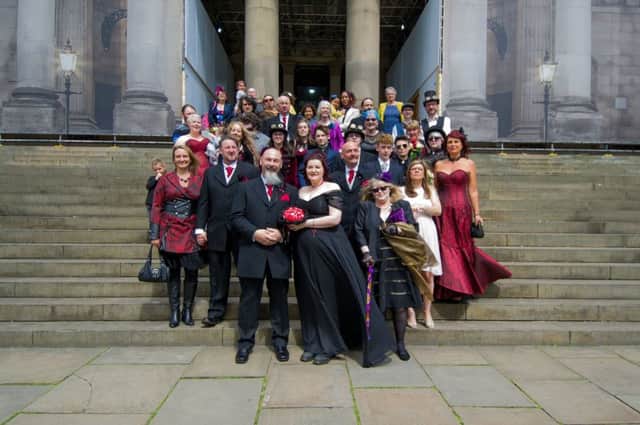 The steampunk newly weds with family anf friends outside Leeds Town Hall.