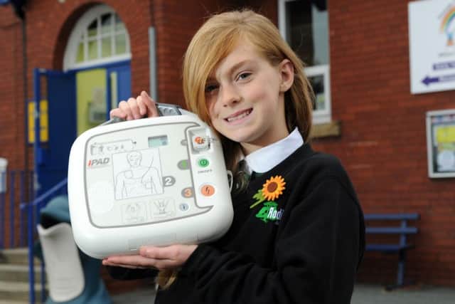 Cody Hartley has donated a defib to her former primary school,  Thorpe Primary School,  to help save lives, and has started a  campaign to get one in every school and public place as part of our first aid campaign.  18 October 2013.  Picture Bruce Rollinson
