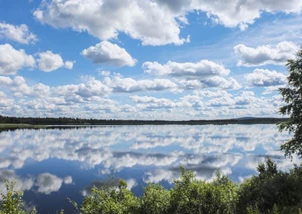 Reflections of clouds on a Swedish lake.