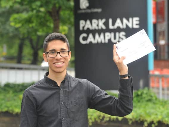 Alessadro Abdel Miseih celebrates his A level results at Leeds City College's Park Lane Campus this morning. Picture: Tony Johnson.