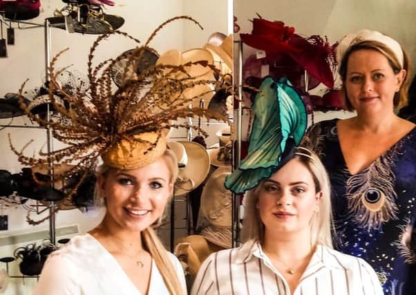 Chloe, left, and Clementine, middle with milliner Jenny Roberts.