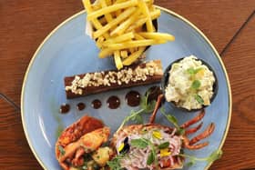 STAR IS BORN: Surf meets snout with belly pork and fresh lobster.