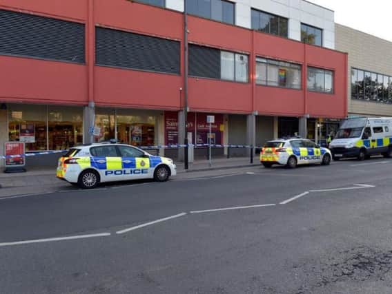 Police investigate outside the Arndale Centre in Headingley.