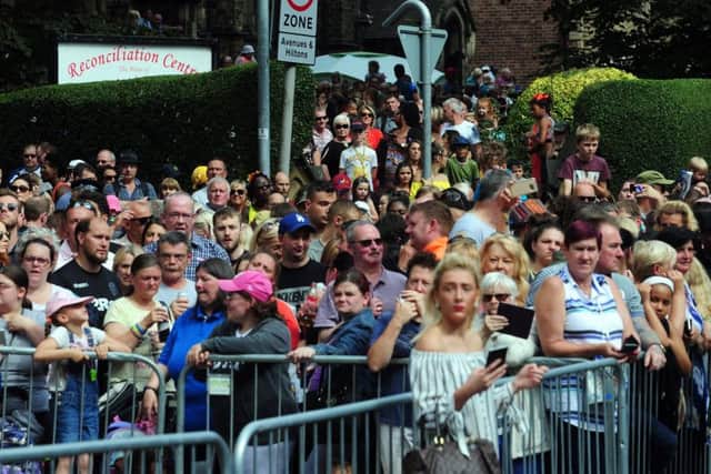 Crowds gather to watch the 50th Leeds West Indian Carnival.