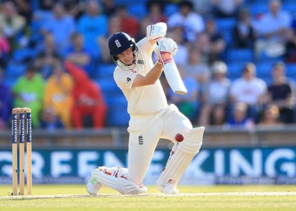 England's Joe Root on his way to another half-century, this time in his side's second innings against the West Indies at Headingley on Monday. Picture: Nigel French/PA