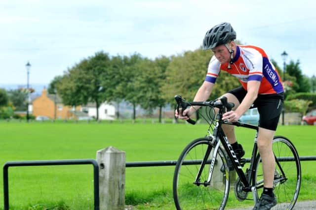 290817 Paul Woodward from Seacroft , Leeds, one of the countries  longest surviving double lung transplant patient  out on his bike for a training run.