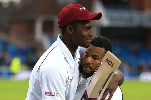 West Indies Shai Hope (facing) is congratulated by Jason Holder after scoring the winning runs at Headingley. Picture: Nigel French/PA.