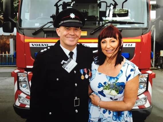 Stanningley Fire Station watch commander Mark Hemingway, pictured with his partner Tracey.