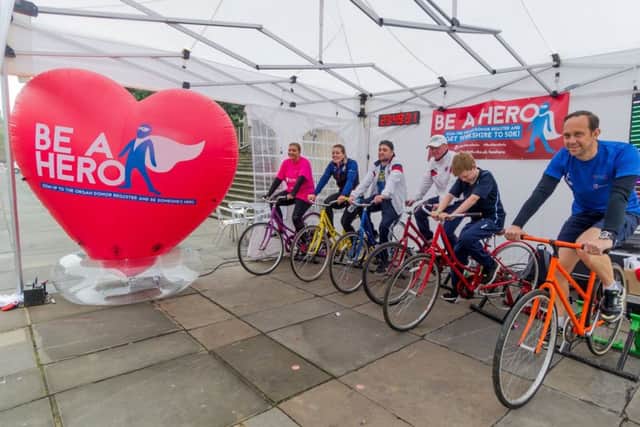 Date: 4th September 2017.Picture James Hardisty.Today is the start of Organ Donation Week and the Leeds Teaching Hospitals NHS Trust is urging people to sign the Organ Donation Register as it relaunches its Be A Hero campaign, with a 24-hour Be A Hero Yorkshire to 50k cycling challenge in Victoria Gardens in Leeds city centre. Pictured (2nd Left) Team GB's Katy Marchant, and (right) British Cycling's Head Sprint Coach Justin Grace,  with volunteers taking part in the challenge.