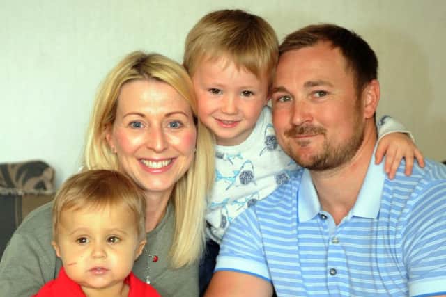 Emma and Phil McDonald pictured in April 2015  with their sons Louie  (centre) and Freddie, who  was born with Alagille syndrome.