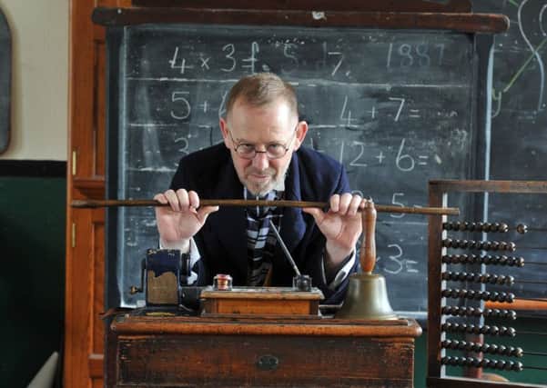 Coullin Meikle plays the part of Victorian schoolmaster in the period classroom at Leeds Industrial Museum this Sunday. Picture by Tony Johnson.