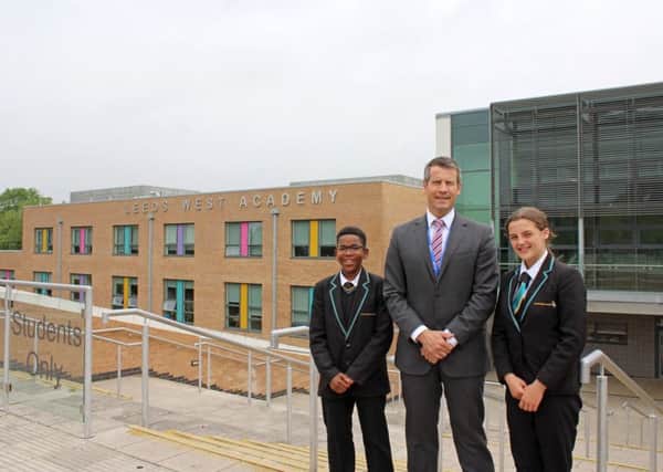 Leeds West Academy principal Christian Wilcocks with students wearing the correct uniform