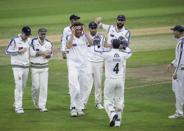 NICE WORK: Ryan Sidebottom is congratulated on dismissing Middlesex's Sam Robson. Picture: Allan McKenzie/SWpix.com