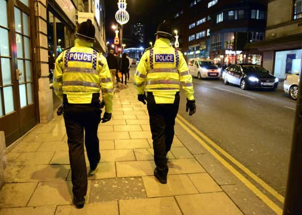 Police on patrol in Albion Street, one of the city's party hotspots. Picture: Bruce Rollinson