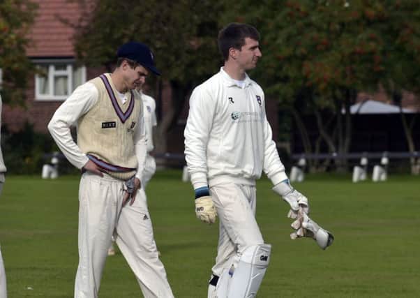 Pudsey Congs players leave the field after the New Farnley innings 
condemned them to relegation (Picture: Steve Riding)
