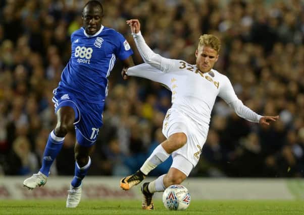 A REAL HANDFUL: Samuel Saiz is pulled down by Cheikh Ndoye. Picture by Bruce Rollinson.