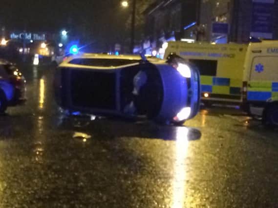 A car ended up on its side after a crash in Horsforth
