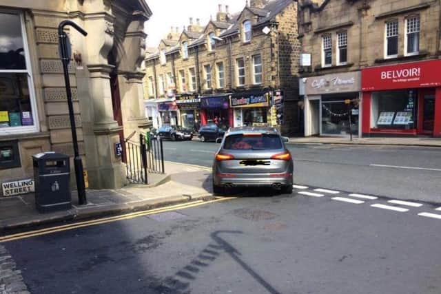 The Audi pictured outside Lloyds bank in  Morley today.