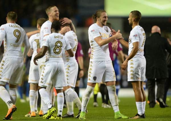 Leeds United's players celebrate after the full-time whistle at Elland Road on Tuesday night, the 2-0 win over Birmingham seeing the hosts go top of the Championship table.
 Picture: Bruce Rollinson.