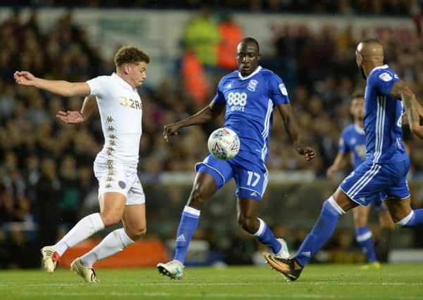 Kalvin Phillips holds the ball as Cheikh Ndoye and Emilio Nsue close in.