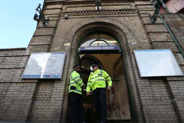 Police officers at the entrance to Parsons Green station in west London which has re-opened after a bomb was detonated on a London Underground train, injuring 29 people. PA