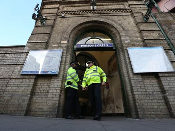 Police officers at the entrance to Parsons Green station in west London which has re-opened after a bomb was detonated on a London Underground train, injuring 29 people. PA