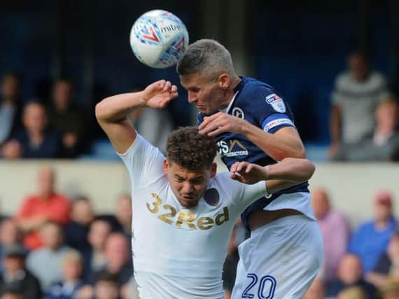 Former Leeds striker Steve Morison climbs to beat Kalvin Phillips in the air