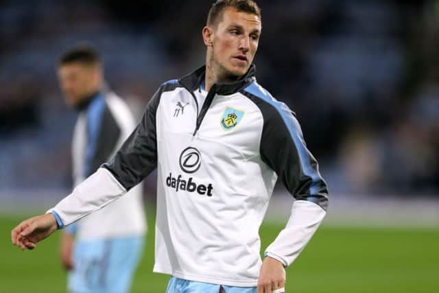 Burnley's Chris Wood warms up before the Carabao Cup clash with Leeds United at Turf Moor. PIC: PA