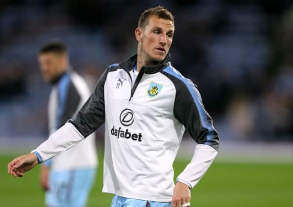 Burnley's Chris Wood warms up before the Carabao Cup clash with Leeds United at Turf Moor. PIC: PA