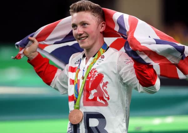Great Britain's Nile Wilson celebrates winning a bronze medal in the men's horizontal bar at the Rio Olympics Games (Picture: Owen Humphreys/PA Wire)