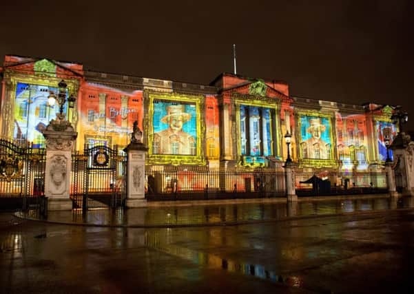 Face Britain Projection on the frontage of Buckingham Palace.