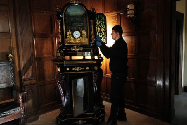 Visitors Assitant Mehdi looks at the Pyke Clock which once belonged to Queen Marie Antoinette of France, at Temple Newsam House, Leeds.19th September 2017 ..Picture by Simon Hulme
